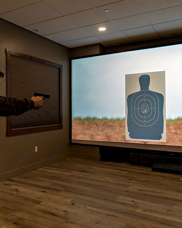 Man practicing in Firearms Training Simulator at Preserve Resort & Spa in 2024
