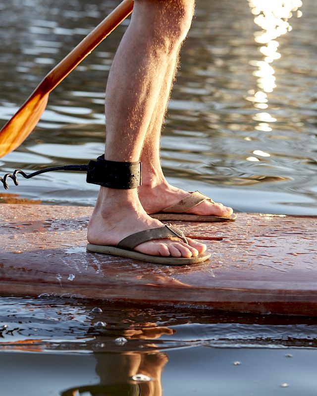 Captivating photo of a paddle boarder's journey at The Preserve Resort & Spa, showcasing the serene environment of the Wood River Pawcatuck Watershed.