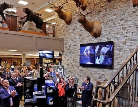 Paul Mihailides at the grand opening of The Sporting Shoppe, as featured in The Westerly Sun.