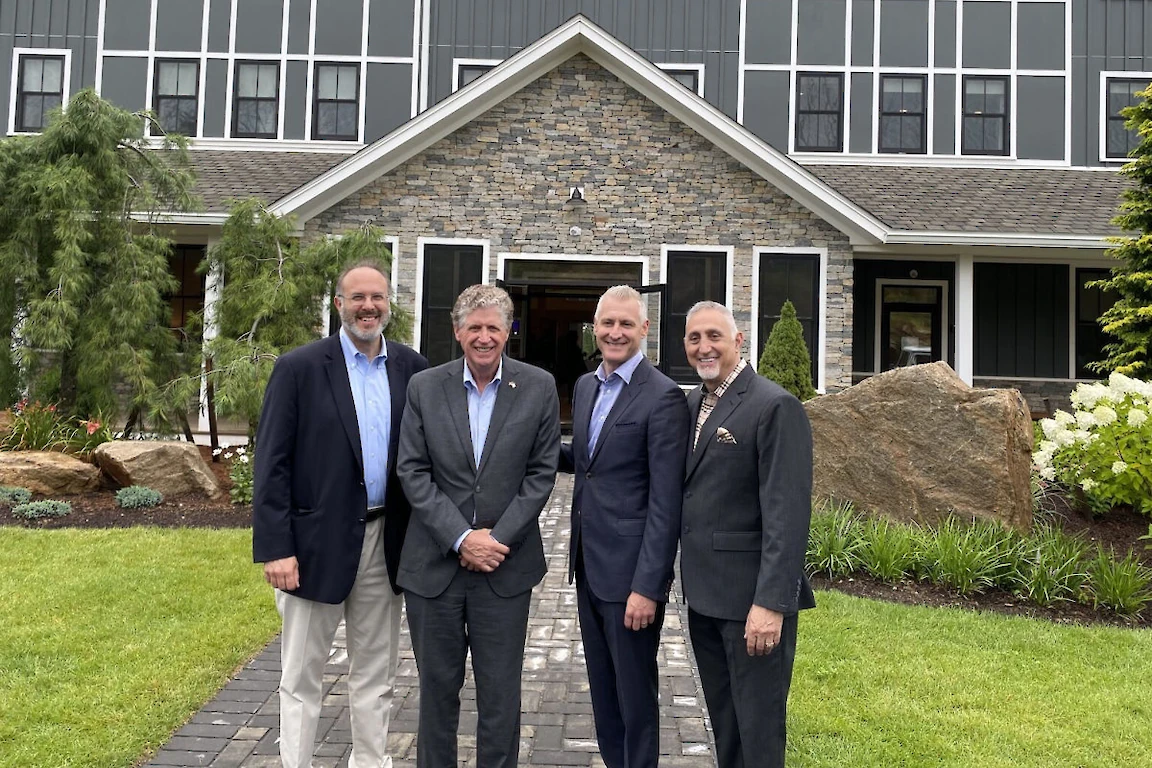 Gov. Dan McKee, with Stefan Pryor and Paul Mihailides, at the new Hilltop Lodge at The Preserve Resort & Spa, as seen in The Westerly Sun.
