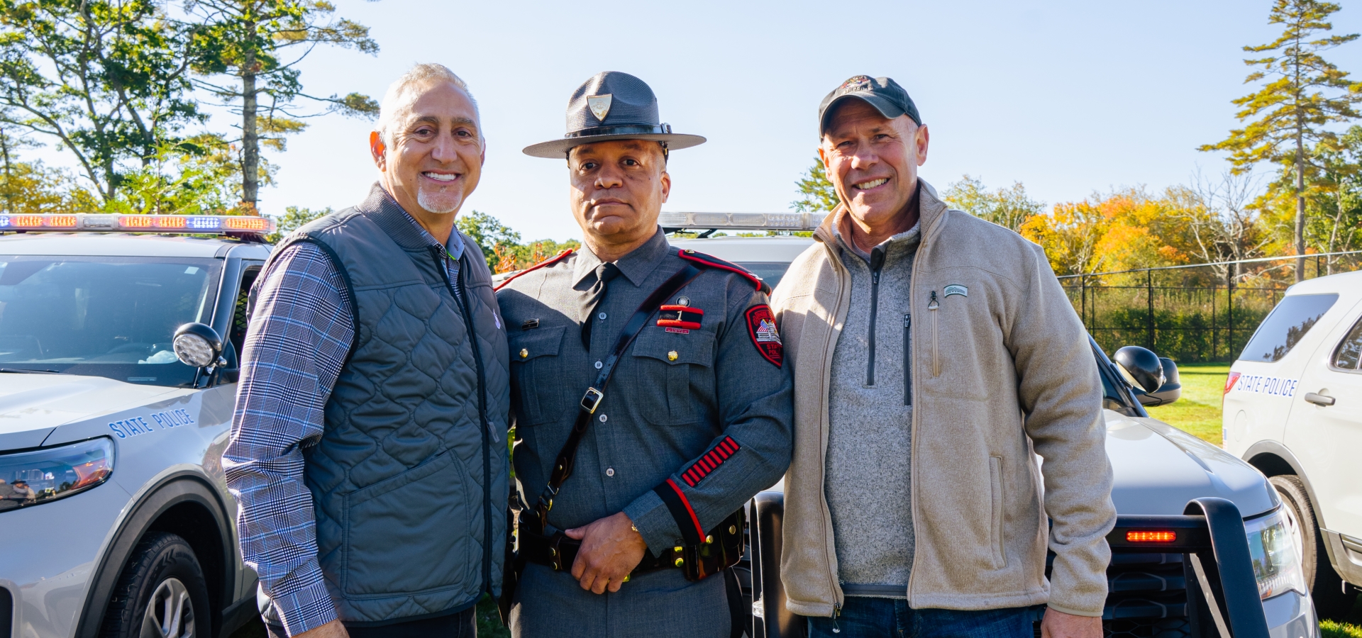 Paul Mihailides with RI Troopers at Special Olympics fundraiser.