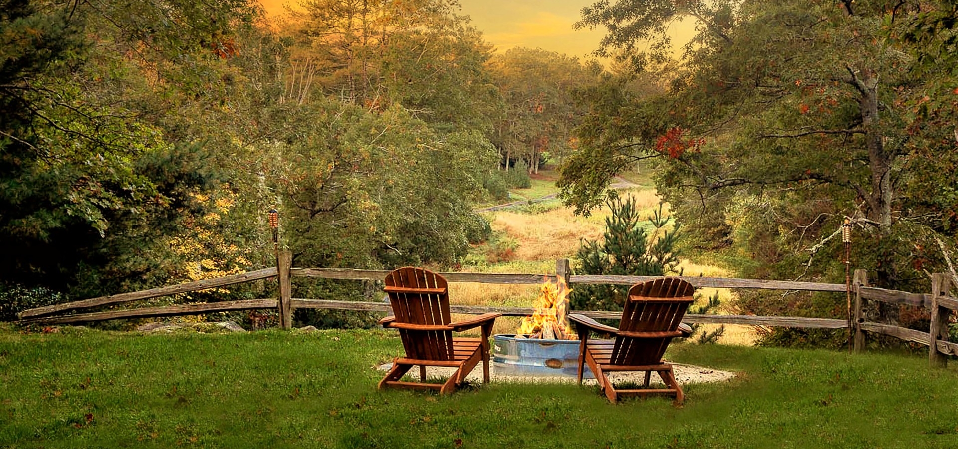 Cozy fire pit with chairs overlooking New England wilderness