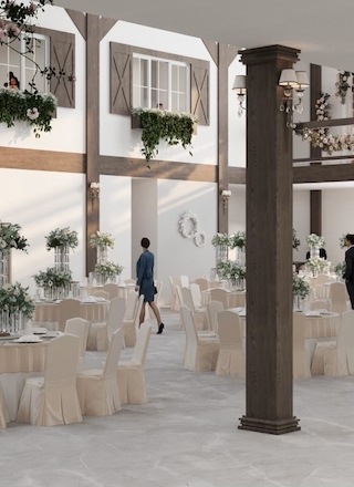 The image shows a spacious and elegant venue with round tables, floral decorations, and people walking around.