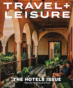 Cover of Travel + Leisure magazine's "The Hotels Issue," featuring an elegant hotel interior with arches and plants.